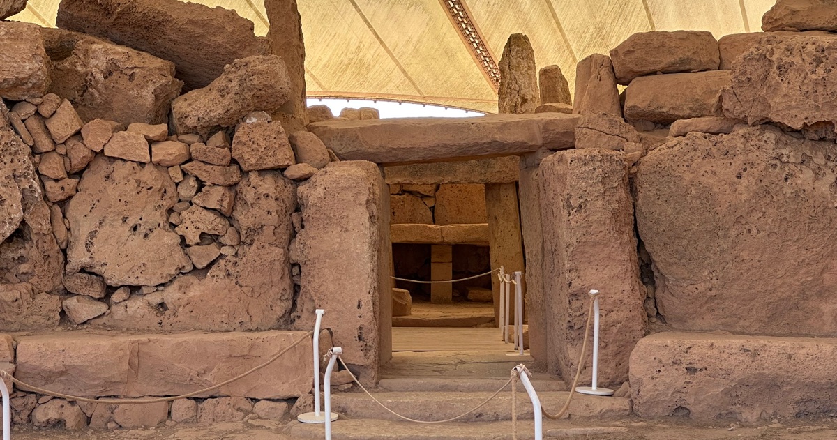 The entrance of Ħaġar Qim temple in Malta under its protective canopy